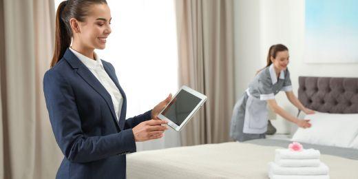 hotel workers complying with lqa standards as described in a tablet