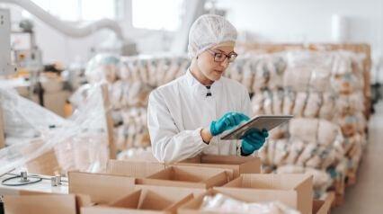 worker conducting food inventory check