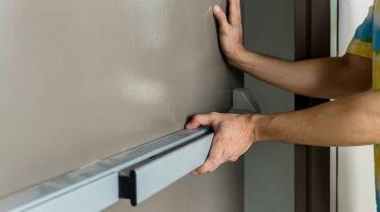 person conducting a fire door inspection