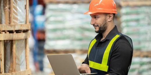 warehouse manager checking warehouse stocks and processes in accordance with supply chain optimization strategies