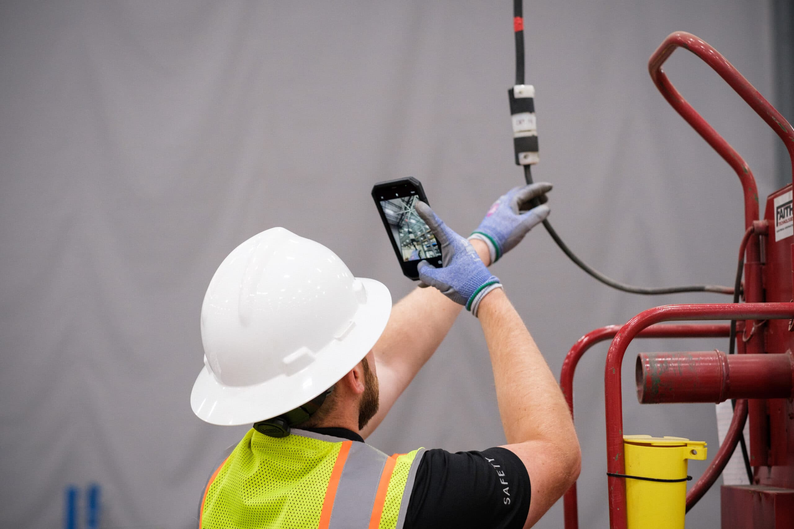 A worker on the ground doing near miss reporting