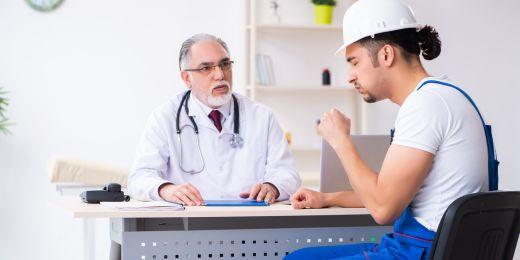 a medical professional checking up on a worker for medical surveillance purposes