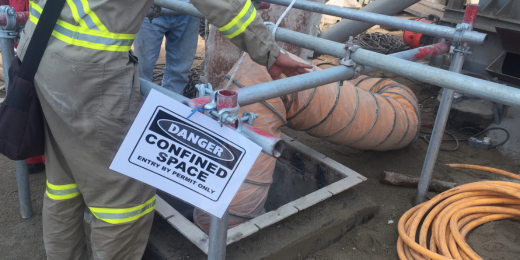 Workers being reminded of safety concerns with a simple safety sign