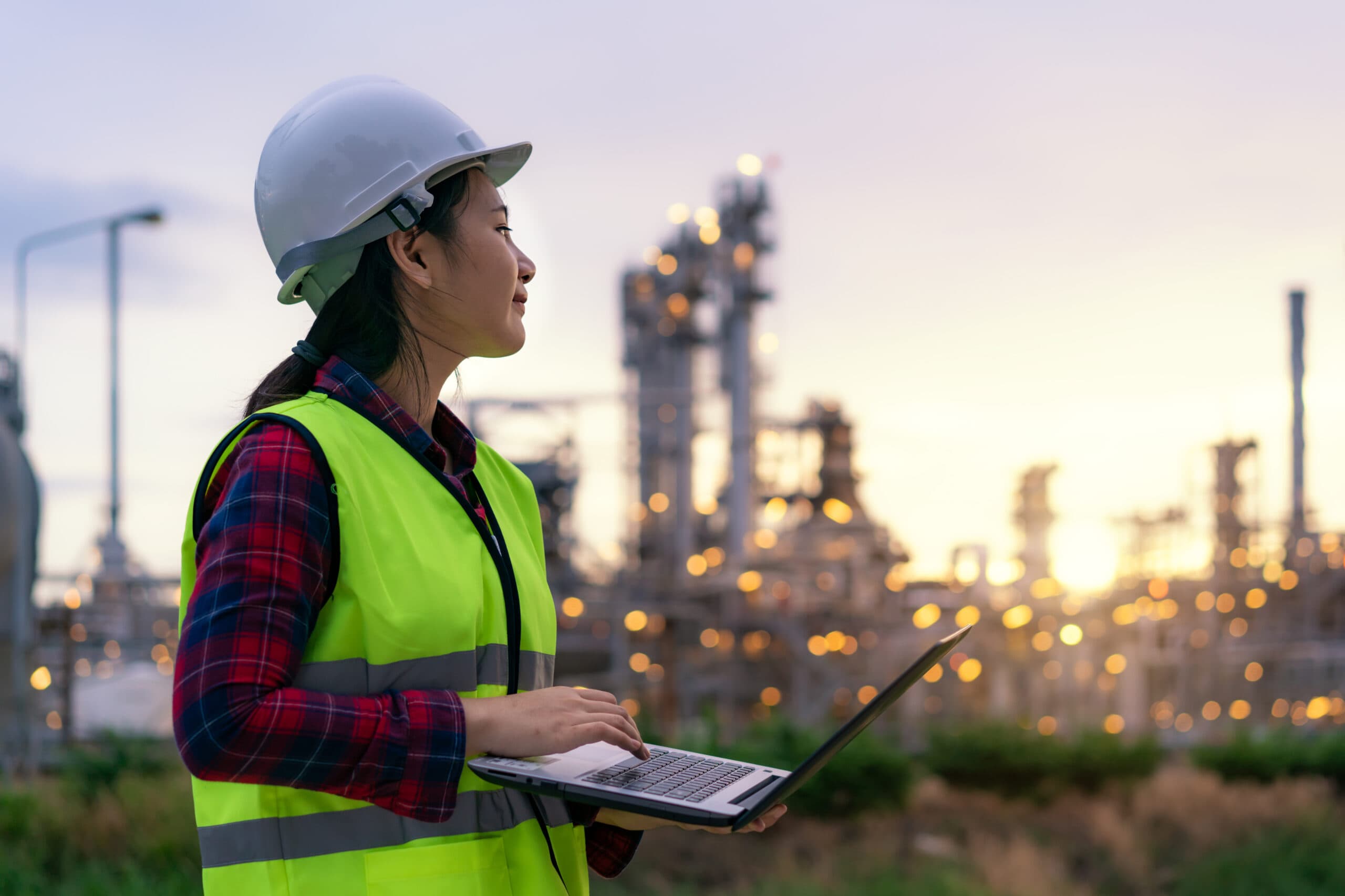 A female inspector analyzing the organization's environmental impact using environmental management software