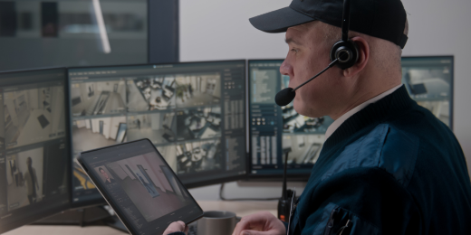 An officer monitoring the facility's physical security