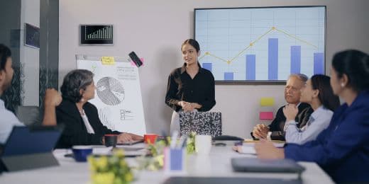 a group of organizational leaders discussing risk culture strategies in a meeting room