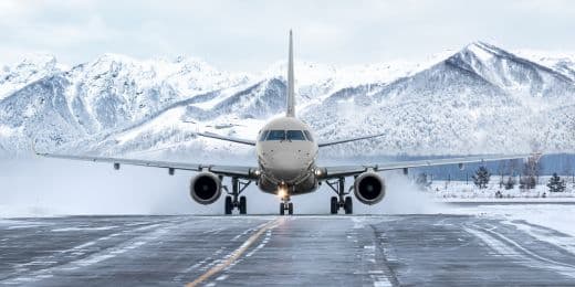 pilot operating a plane flying in snow