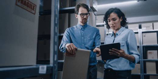 An inventory manager going through a cmms software with her employee.