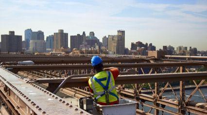 Man wearing PPE inspecting a bridge|Man wearing PPE inspecting a bridge||Bridge Inspection Checklist Template