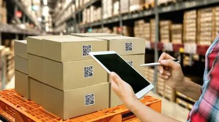 an asset manager using a tablet and software to fill out an asset inventory template in a warehouse|Asset Inventory Template Sample Report|Asset Inventory Template