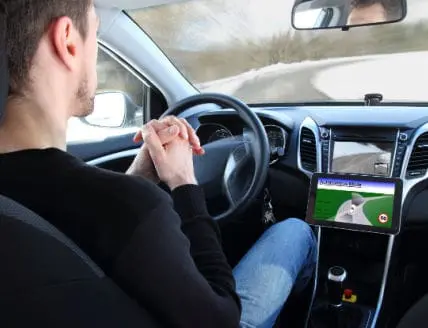 A man in a Autonomous driving test vehicle