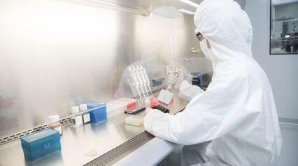 lab worker following biosafety level guidelines