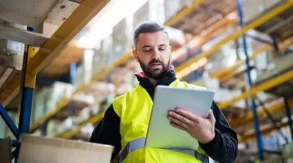 warehouse employee with a tablet