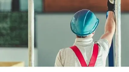 a worker wearing a hard hat as head protection while working