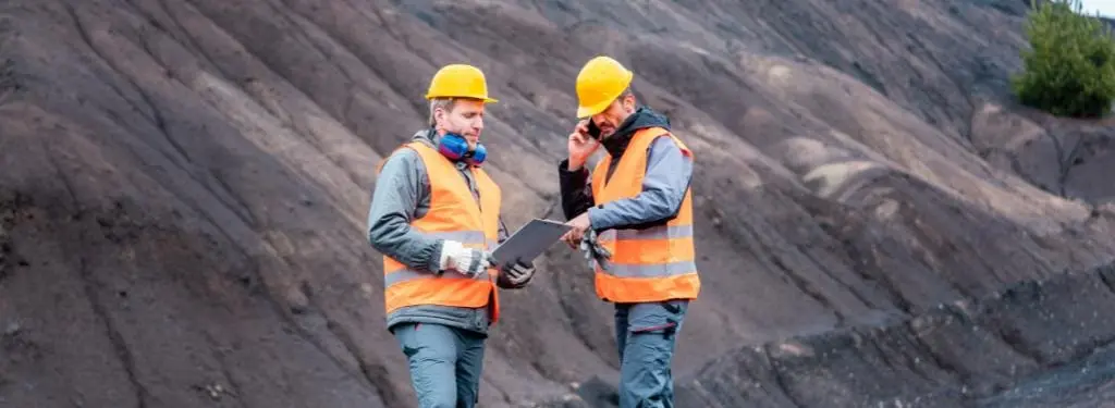 miners survey the open pit using a mining software|Vulcan by Maptek Logo|Deswik Logo|RPM MinePlanner Logo|Datamine Logo|Micromine Logo