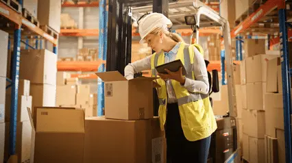 product inspector checking packages for shipment