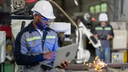 mechanical worker using a safety culture assessment form on a laptop at work|Safety Culture Assessment