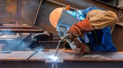 welder performs work safely using welding ppe