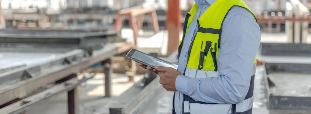 engineer using an apqp software on their tablet at work