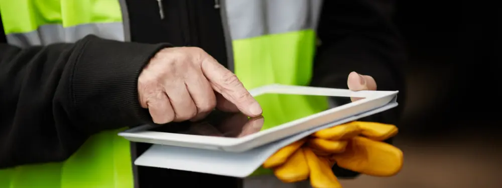 a worker using a mobile app for operations
