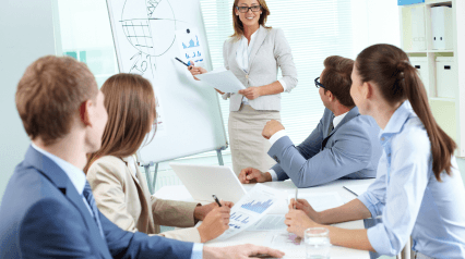 team leader explaining training metrics to employees