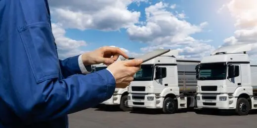 fleet manager using telematics on their tablet and their trucks
