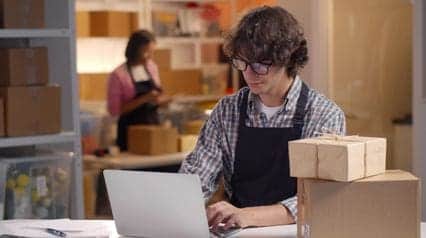 a retail supervisor taking care of an online product return through the reverse logistics process