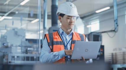 a manufacturing supervisor conducting a job task analysis on site