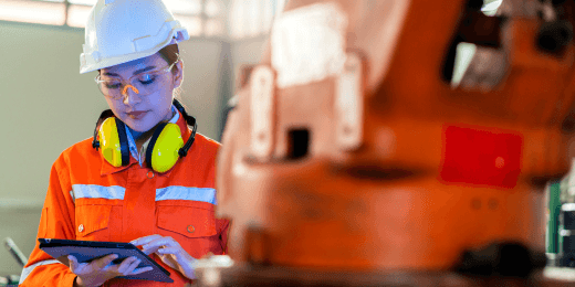 Machinist conducting a machine risk assessment