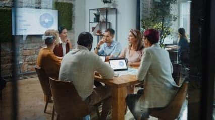 people conducting a product life cycle meeting