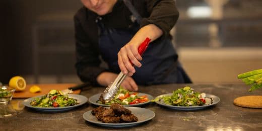hotel restaurant worker handling food and plating them