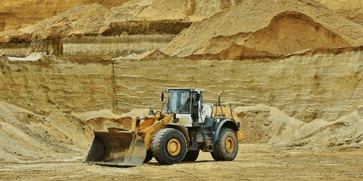 Workers performing mechanical excavation