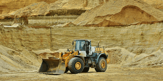 Workers performing mechanical excavation