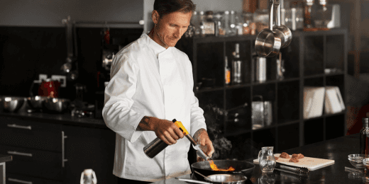 A worker answering a cooking and hot holding temperature checklist.