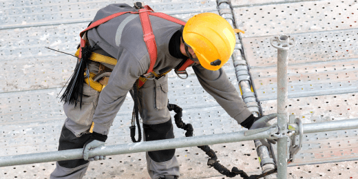 A worker following the personal protective equipment at work regulations