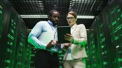 two workers using an IT incident report template in a system room|IT Incident Report Template Sample|IT Incident Report Template