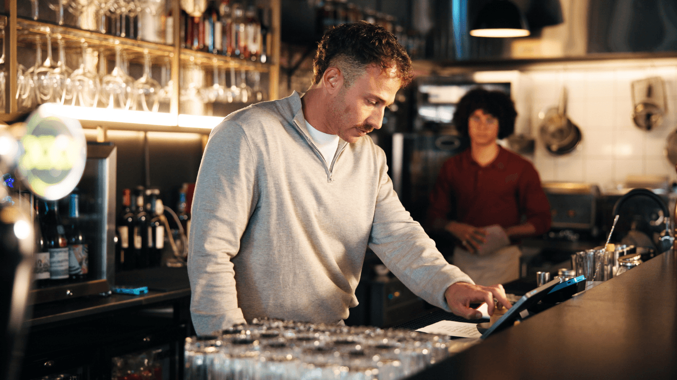 A staff member is checking the liquor license conditions checklist.