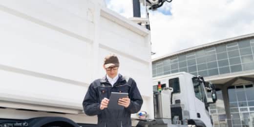 fleet manager using telematics on their tablet and their trucks