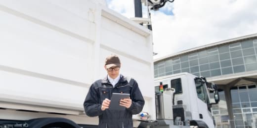 fleet manager using telematics on their tablet and their trucks