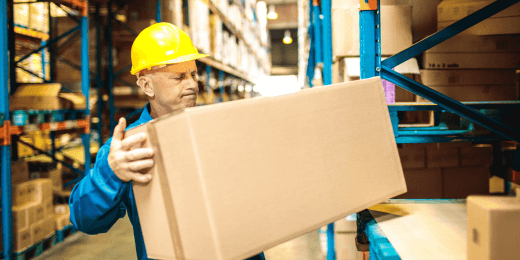 A worker is doing a practical assessment for lifting safety training.