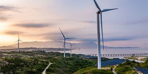 Solar panels, wind turbines, and land for harvesting clean energy and powering an entire community