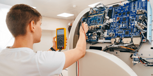 A engineer inspecting a complex medical device.