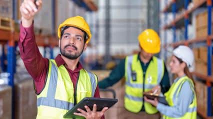 supply chain management stakeholders conducting site inspections using tablet