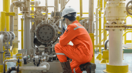 worker conducting a pump maintenance