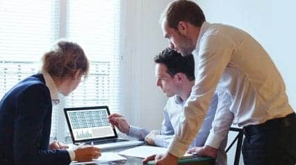 business leaders review their data management plan