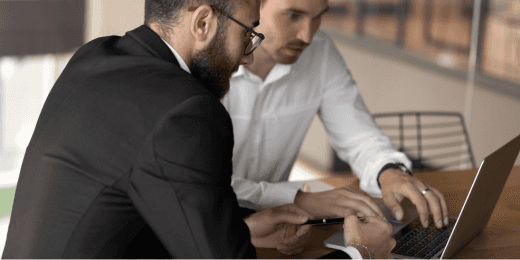 Two businessmen negotiating clauses following the contract lifecycle management processes