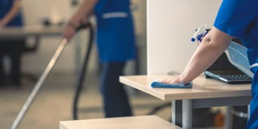 workers cleaning an office with special chemicals as part of an activity for world antimicrobial resistance awareness week at work