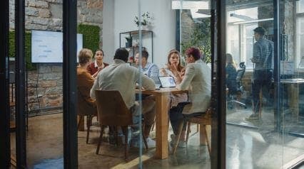 people having a meeting following the ansoff growth matrix