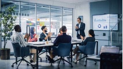 employees discussing quality improvement