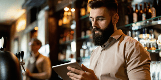 Bartender using a bar deep cleaning checklist